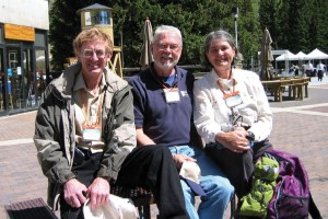 Three people smiling at the camera.