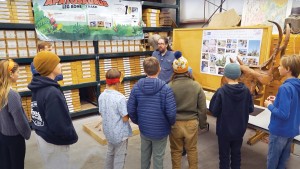 Ben Sears with students at the Earth Science Week paleontology station, 2022.