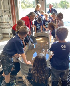 Suzanne Sawyer (red shirt) at the Earth Science Week “gold” panning station, 2022.