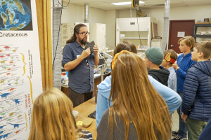 Ben Sears teaches students about Paleontology at Earth Science Week 2023.