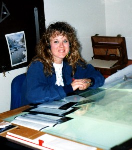 A person sitting at a light table.