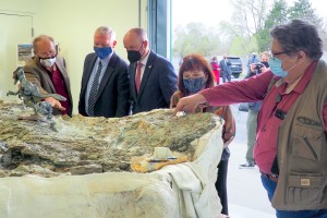 UGS Director Bill Keach and State Paleontologist Dr. James Kirkland show off the Utahraptor megablock.