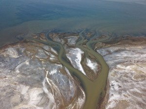 A bird-foot delta forms as Lee Creek sinuously winds through mud flats along the southeastern shore of Great Salt Lake. Aerial view from a drone. Photographer: Adam Hiscock 2018