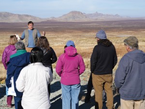A person explains the geology at Simpson Springs during the 2023 Administrative Professionals Geologic Field Trip.
