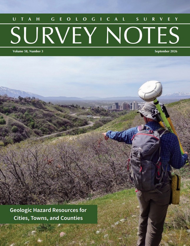 Cover of Survey Notes 58-3. A man with landslide sensing equipment points to a geologic feature with Salt Lake City in the background.