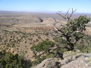 The Narrows, a V-shaped notch at the west end of Parowan Gap, is a geologic feature known as a wind gap cut through resistant Navajo Sandstone by a stream that existed prior to and during uplift of the Red Hills. Photographer: Bob Biek