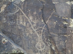 A petroglyph is an image that has been carved or engraved into a rock surface. The meanings of many petroglyphs at Parowan Gap have been lost over time. Multiple contemporary interpretations of the Zipper Glyph include a travel map, symbolizing the journey path and time taken, or perhaps a solar calendar with an outline that conforms to the contours of the Gap at The Narrows. Photographer: Bob Biek